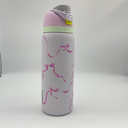 32oz Owala FreeSip water bottle in the "Tied and True" colorway, featuring a pink bow ribbon print
