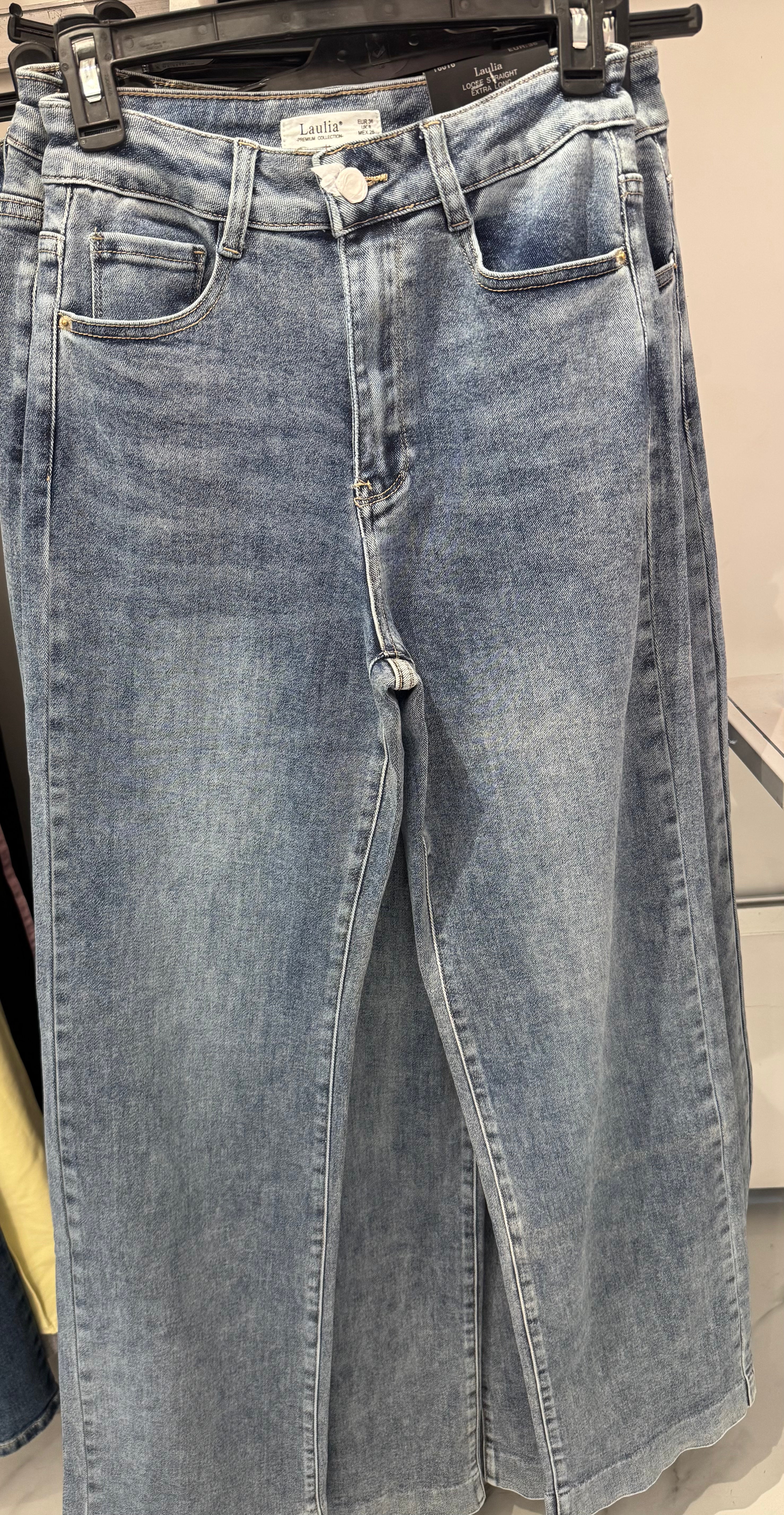 Laulia jeans feature a wide-leg design and a high-waist fit.