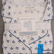 women's blue printed boyfriend pyjamas featuring a white fabric with a blue floral polka dot pattern.