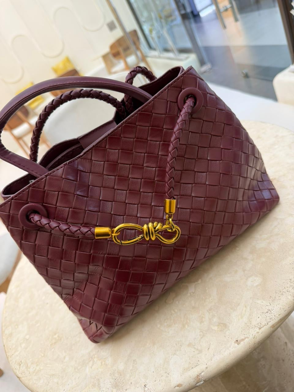 Bottega Veneta Andiamo handbag woven leather in a deep barolo red.