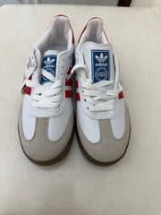 white and red Adidas Samba OG sneakers feature classic serrated stripes