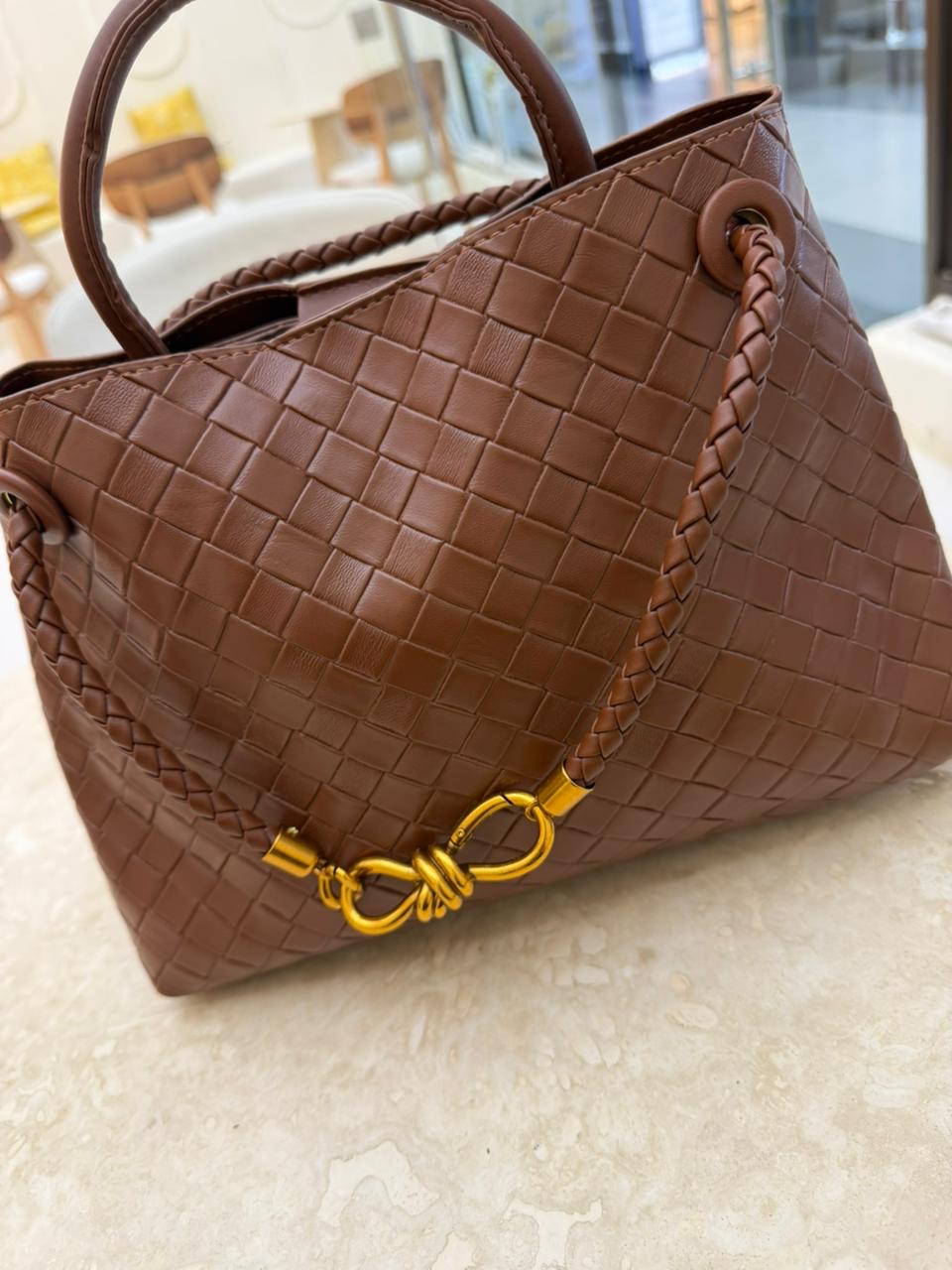 Brown Bottega Veneta Andiamo handbag features the brand's signature Intrecciato woven leather