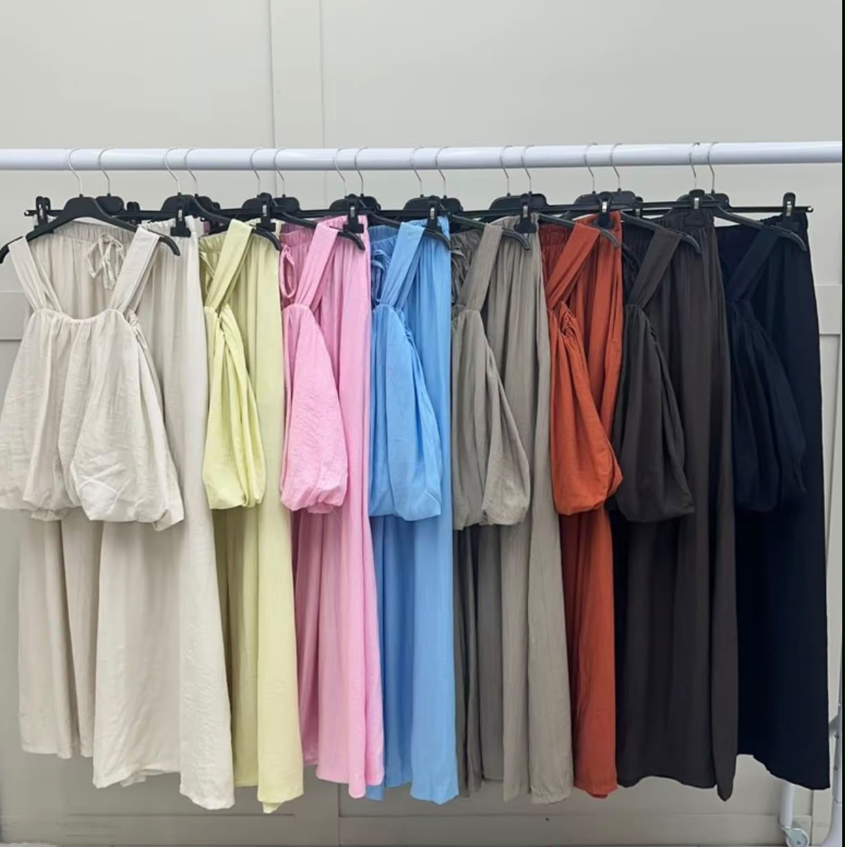2-piece set features a ruffled camisole top and wide-leg palazzo pants.