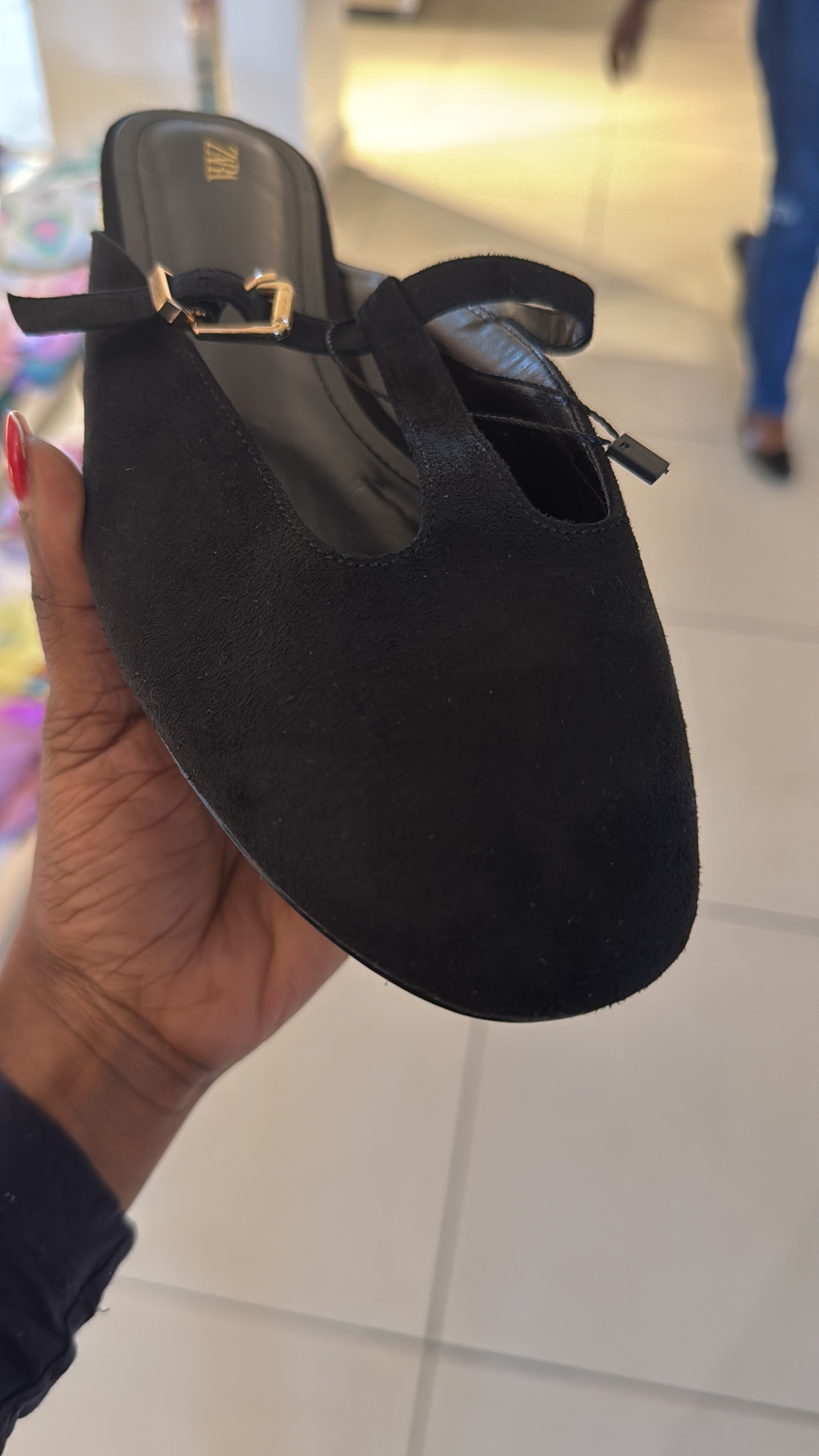 Zara black mule shoe with a strap and buckle detail