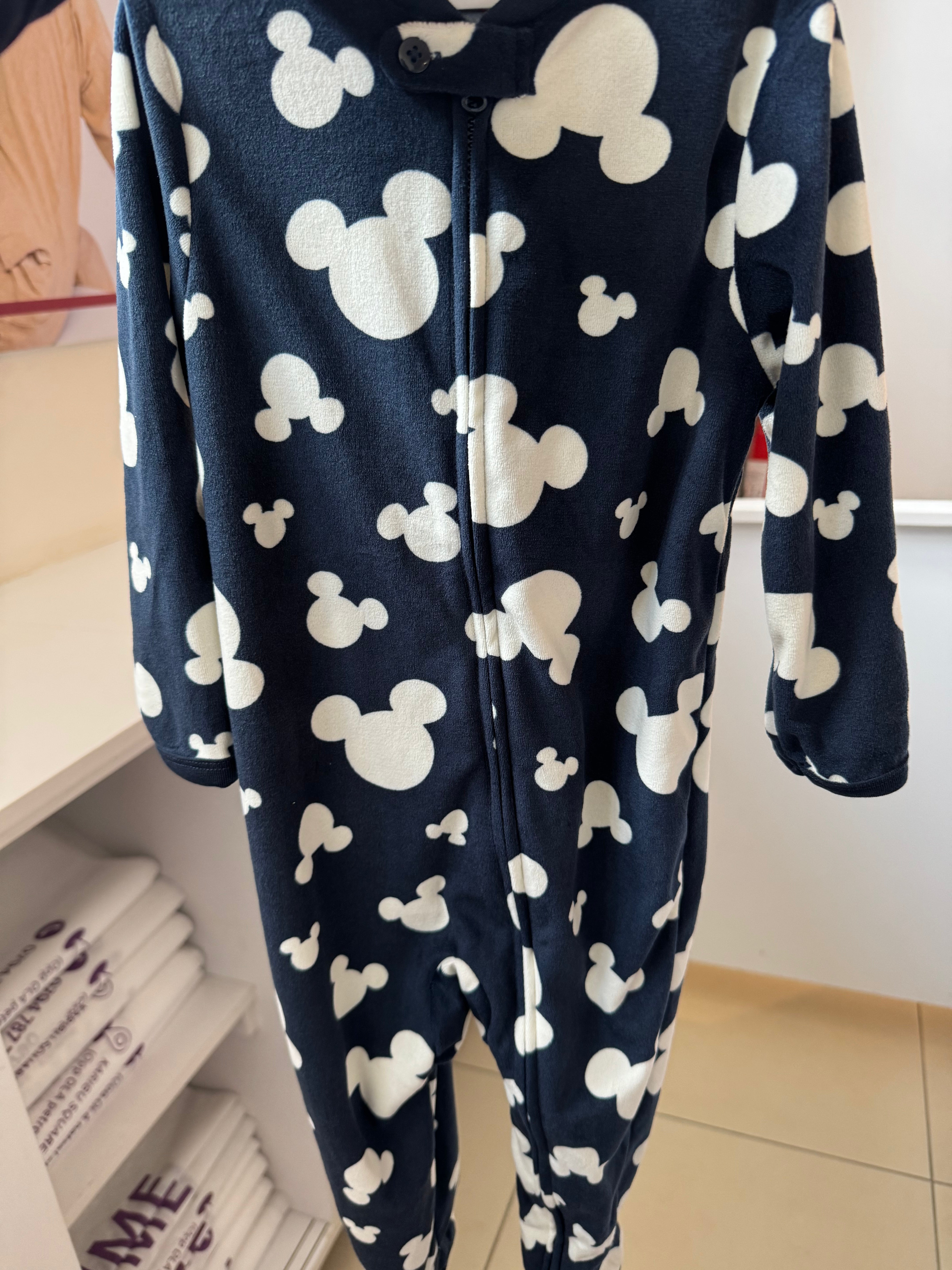 Primark Disney baby sleepsuit with a cloud like pattern of Mickey head