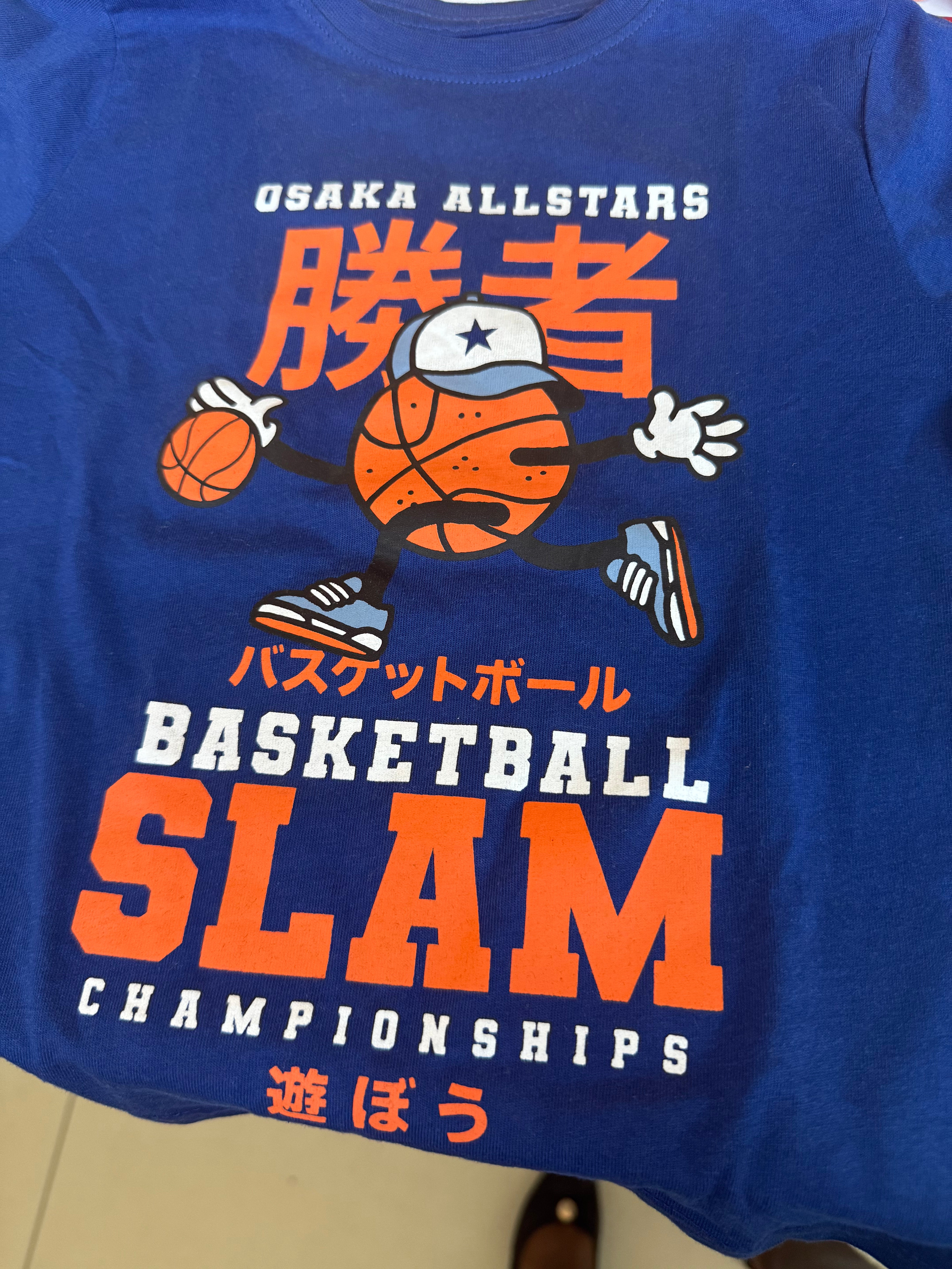 Primark cares with a basketball graphic and Japanese text