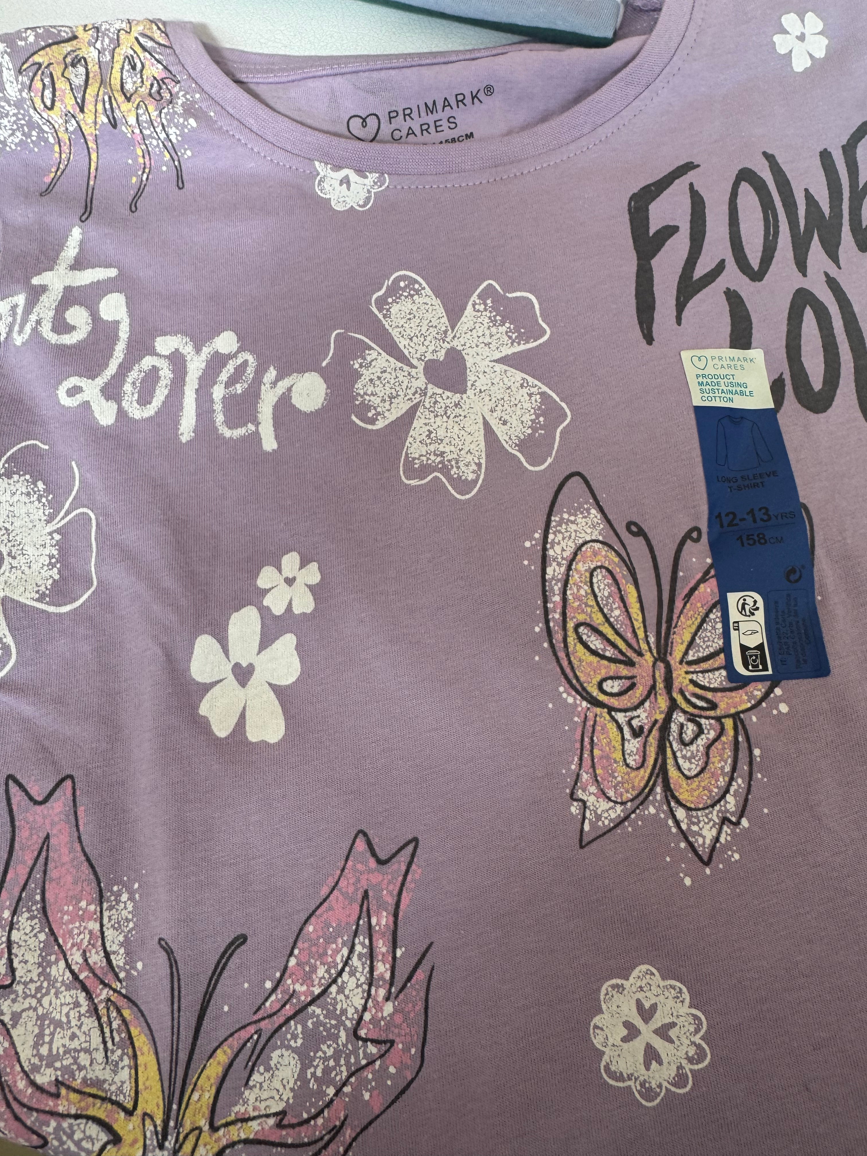 Primark care long sleeve top with a butterfly and flower graphic