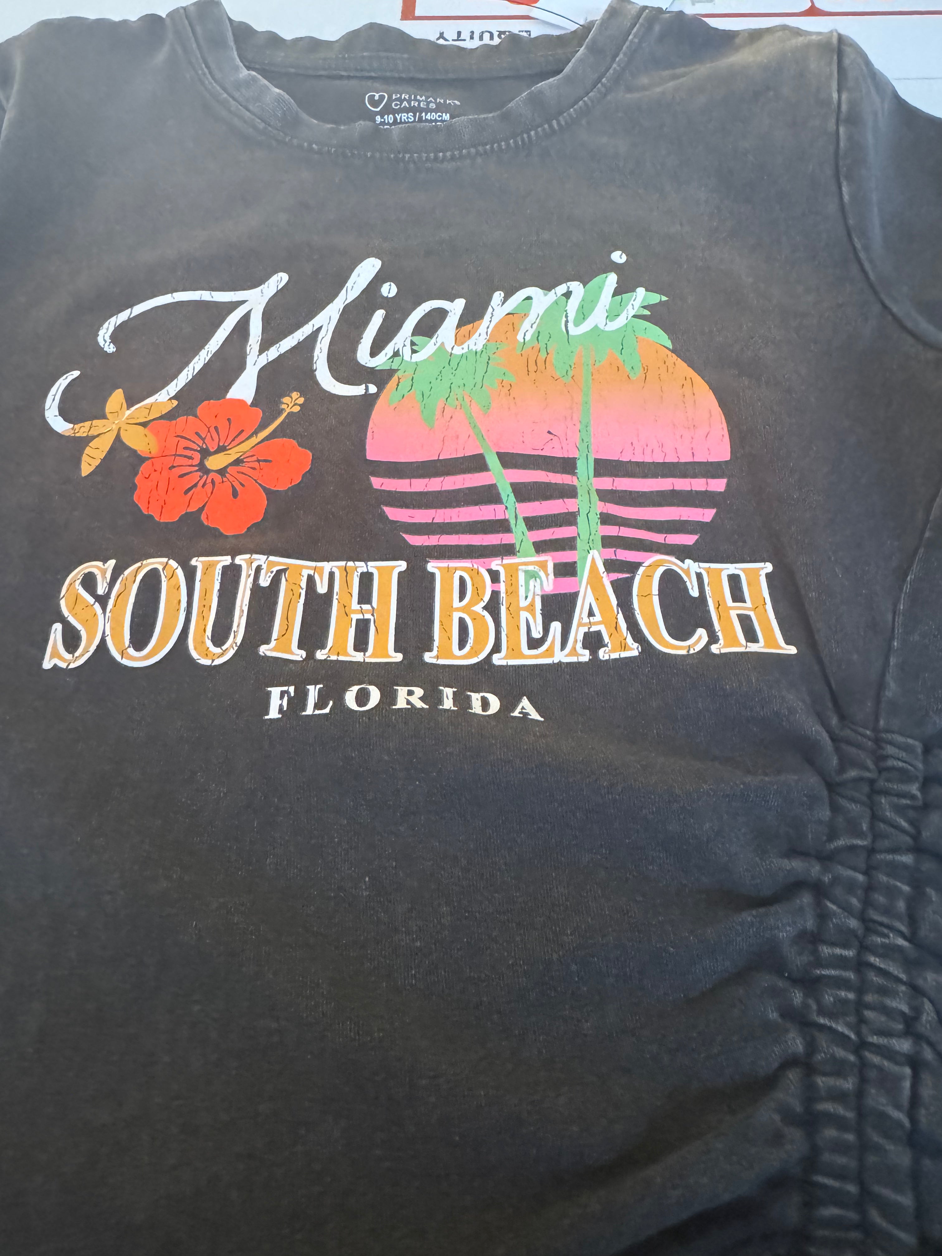 Primark t-shirt featuring a retro style with a Miami south beach graphic