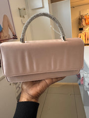 Pink satin crossbody bag with rhinestone top handle